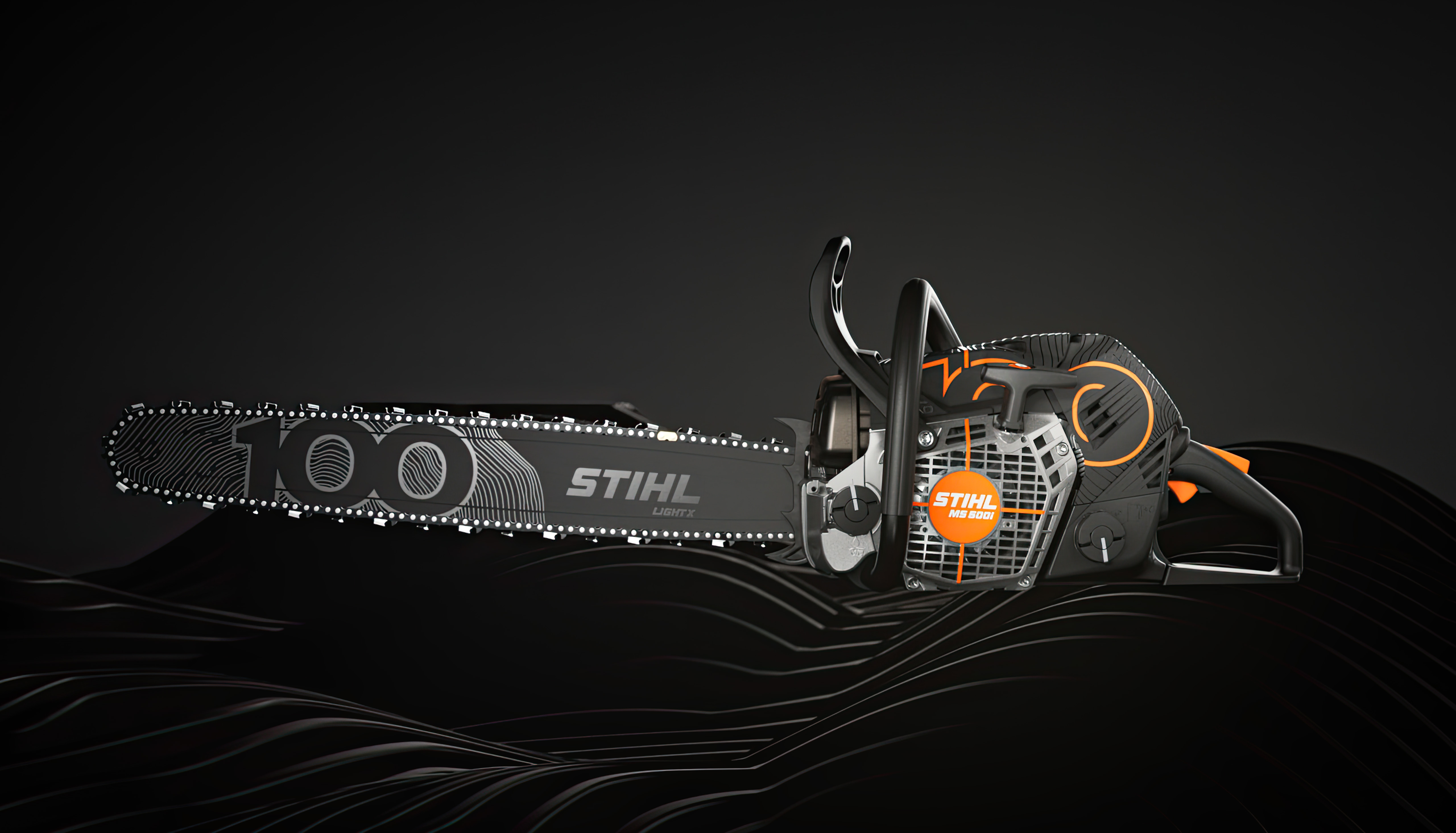 STIHL chainsaw MS 500i Centennial Edition side view left in front of a black background